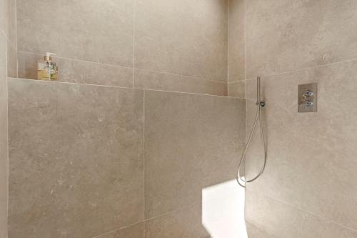 a bathroom with a shower with a shower at La Master Grange De Queyran in La Palud-sur-Verdon