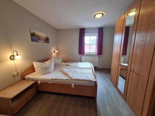 a small bedroom with a bed and a window at Orth A4 in Orth