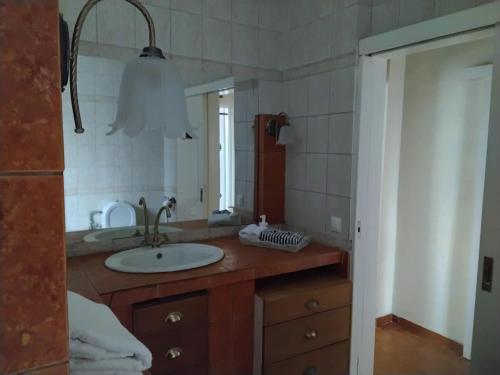 a bathroom with a sink and a mirror at Peaceful oasis in Athens