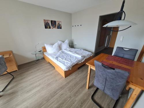 a small room with a bed and a table at Orth A5 in Orth
