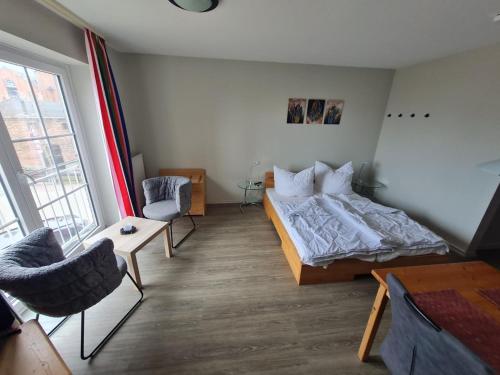 a bedroom with a bed and a table and chairs at Orth A5 in Orth