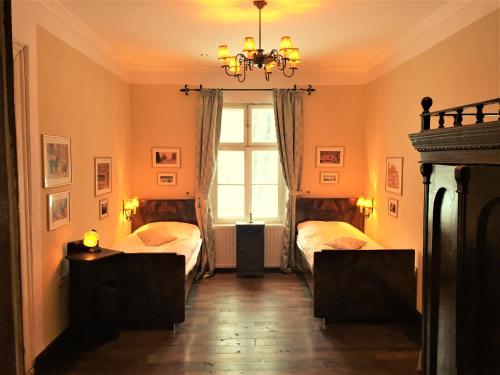 a bedroom with two beds and a window at Zabola Estate - Transylvania in Zăbala