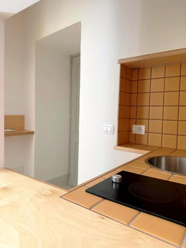 a kitchen with a sink and a counter top at Cefalhub in Cefalù