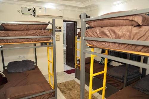 a group of bunk beds in a dorm room at Connect Backpackers Hostel in Chennai