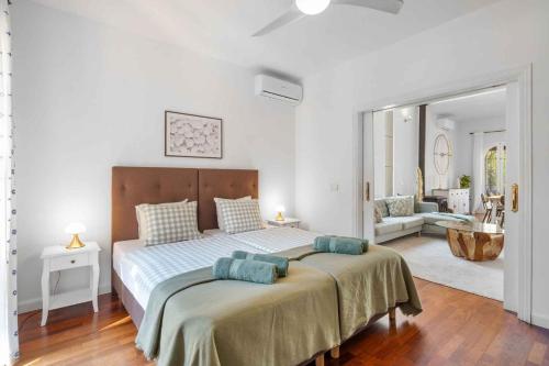 a bedroom with a bed and a living room at Villa Playa Felostal in Palma de Mallorca