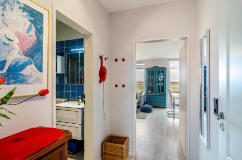 a bathroom with a sink and a mirror at Ferienhaus Raschke in Norderney