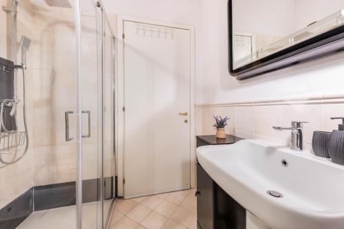 a bathroom with a sink and a shower at Residence La Piopa in Polpenazze del Garda