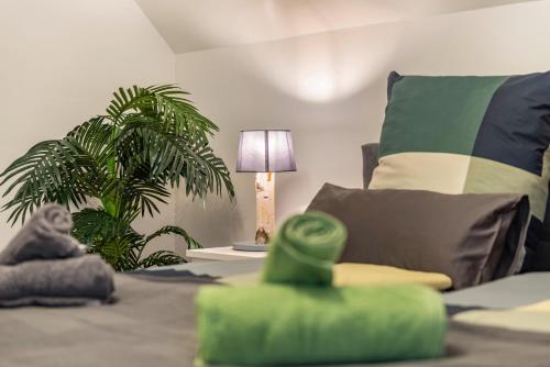 a living room with a couch and a plant at Appartement Bergblick in Stockach