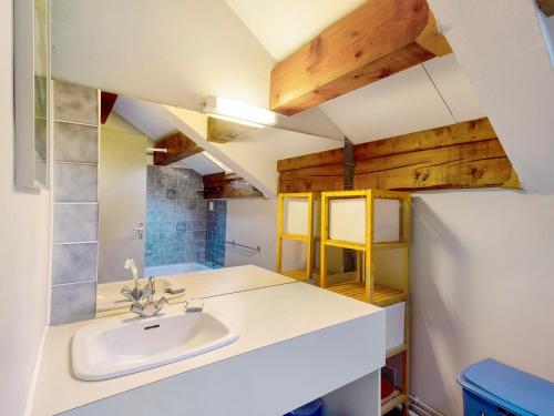 a bathroom with a sink and a refrigerator at Chalet Lilette in Font-Romeu-Odeillo-Via
