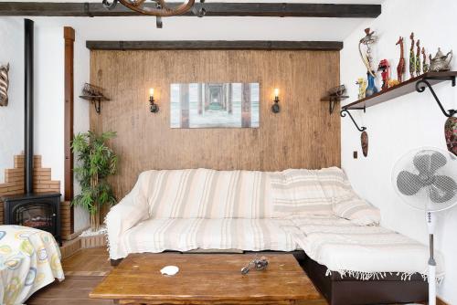 a living room with a couch and a table at Villa Canijo in Barbate