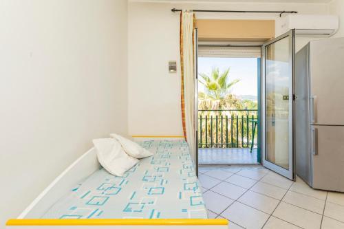 an open door to a room with a balcony at I Ciottoli Dello Ionio in Mascali