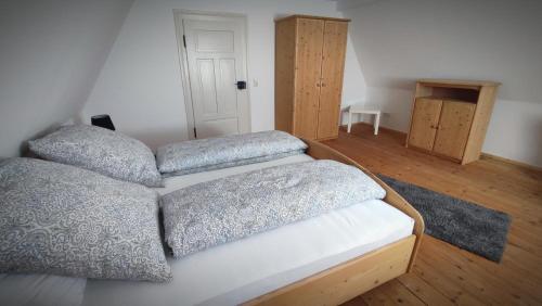 a bedroom with two beds with pillows on it at Ferienwohnung La Maison Palatinate in Kapsweyer