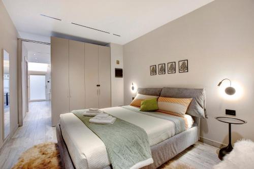a bedroom with a bed and a table in it at Maison Bijoux Aosta in Aosta