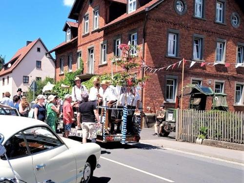 a group of people standing on the side of a street at Ferienwohnung Zur Eisenbahn in Fladungen