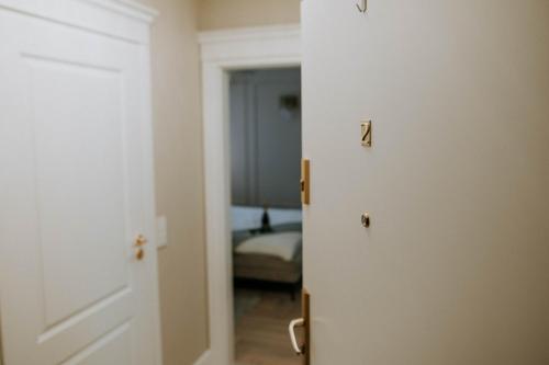 an open door to a bedroom with a bed at Apartament Kościuszki Nowa Sól in Nowa Sól