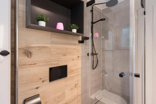 a bathroom with a shower with a glass door at Traumblick in Bad Liebenzell