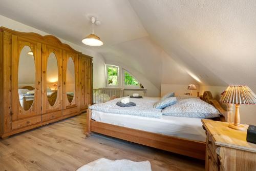 a bedroom with a large bed and a window at Ferienhaus im Grünen in Harsefeld