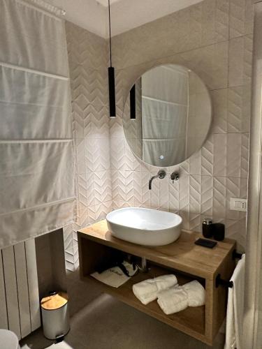 a bathroom with a sink and a mirror at Villa Romantica Lake Idro in Bagolino