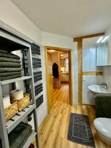a bathroom with a sink and a toilet at Wohnung In Wolfenbüttel in Wolfenbüttel