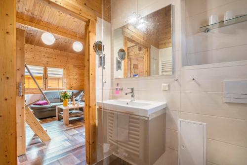 a bathroom with a white sink in a room at Ferienhaus 4 Familie Täubert in Klein Uhyst