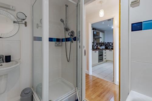 a bathroom with a shower and a sink at Penthouse Split Level 5 min walk to City Centre in Coventry