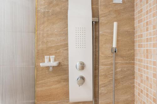 a shower with a glass door in a bathroom at Motel katerina in Keratea