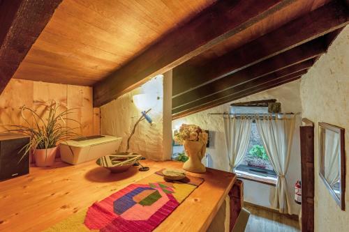 a room with a wooden table in a room with a window at Casa Palmera - Private Paradise in Tacoronte