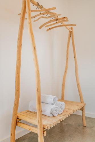 a wooden swing with white towels on it at Cas Suis 9 in Campanet