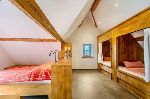a bedroom with a bed and two bunk beds at Gästehaus Wüpping 3 in Salem