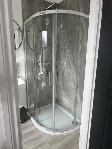 a shower with a glass enclosure in a bathroom at 1st Floor 1 Bed Studio in Weston-super-Mare