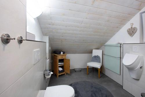 a bathroom with a toilet and a sink at Landhaus Dachsberg in Wittenschwand