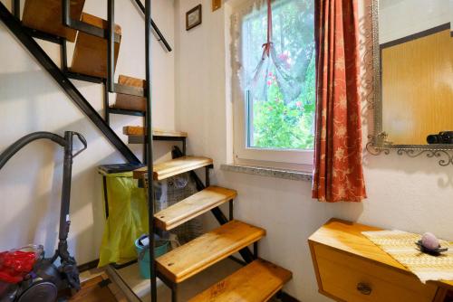 a room with some wooden steps and a window at Ferienhaus Carpin in Carpin