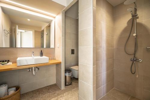 a bathroom with a sink and a shower at Joy Breeze in Kefallonia