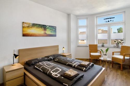 a bedroom with a large bed in a room at Ferienwohnung Eichendorff in Nordhausen
