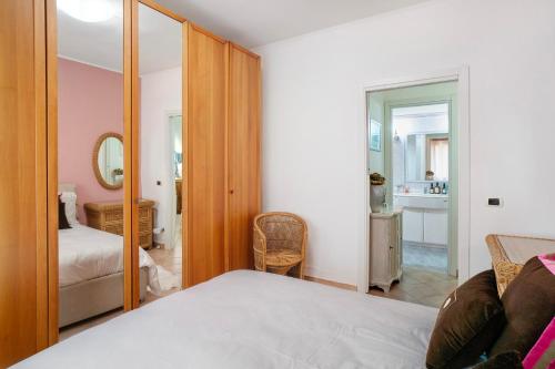 a bedroom with a bed and a mirror at Salice Felice in Ventimiglia
