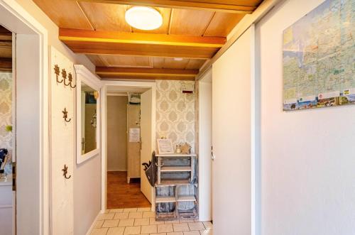 a hallway of a house with wooden ceilings at Ferienhaus Segelboot in Krummhörn
