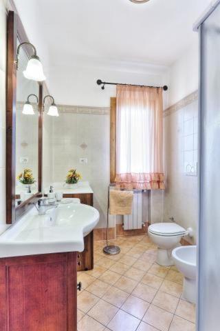 a bathroom with a sink and a toilet at Casa Consuelo App. 1 (trilocale) in Capoliveri