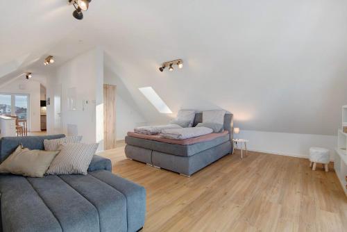 a large living room with a couch at Dachstudio am Donau Rad Weg in Tegernheim