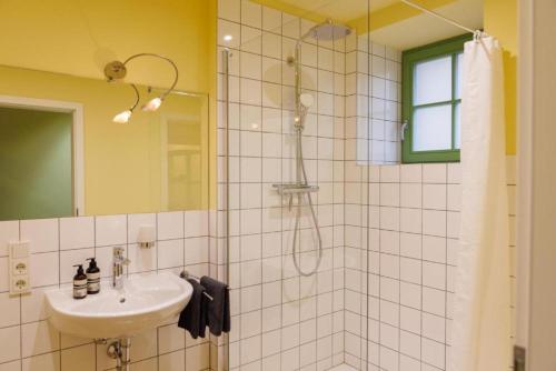 a bathroom with a sink and a shower at Ferienhaus Monteverde in Meddersheim