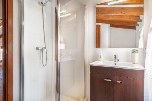 a bathroom with a sink and a shower at Ca na Francesca in Pollença
