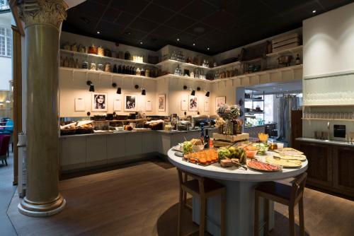 a buffet of food on a table in a restaurant at Hotel Kung Carl, WorldHotels Crafted in Stockholm