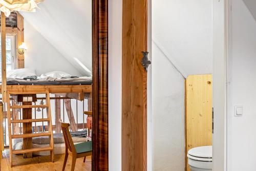 a room with a bed and a table with a chair at Tiny House an der Werra in Bad Sooden-Allendorf