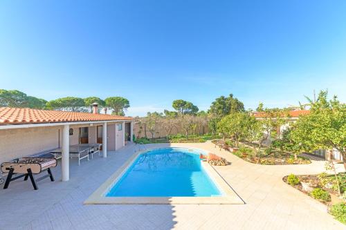 an image of a swimming pool on a patio at Beautiful Deluxe Villa 4 Bedroom in Aldeia de Brescos