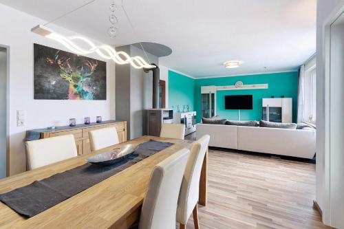 a kitchen and dining room with a table and chairs at Sonnenblick in Lenzkirch