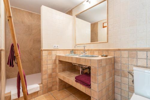 a bathroom with a sink and a mirror at Finca Biniali in Sencelles