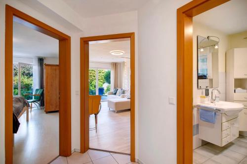a hallway with a kitchen and a living room at Easy Living in Tettnang