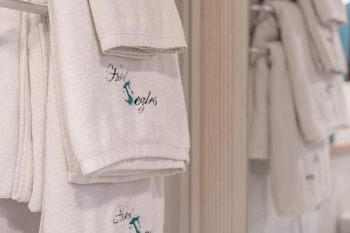a group of shirts hanging on a wall at Segles 11 in Campos