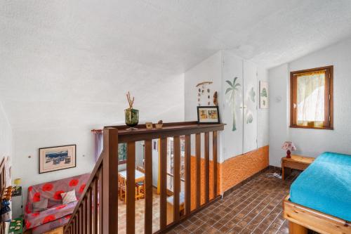 a living room with a staircase in a house at Bastidon Avec Terrasse Vue Mer in Carqueiranne