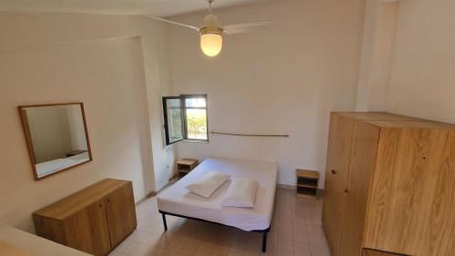 a living room with a white couch and a mirror at Appartamenti Con Vista Mozzafiato in Praia a Mare