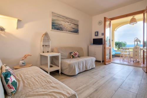 a living room with a couch and a table at Relax Space in Cascabraga